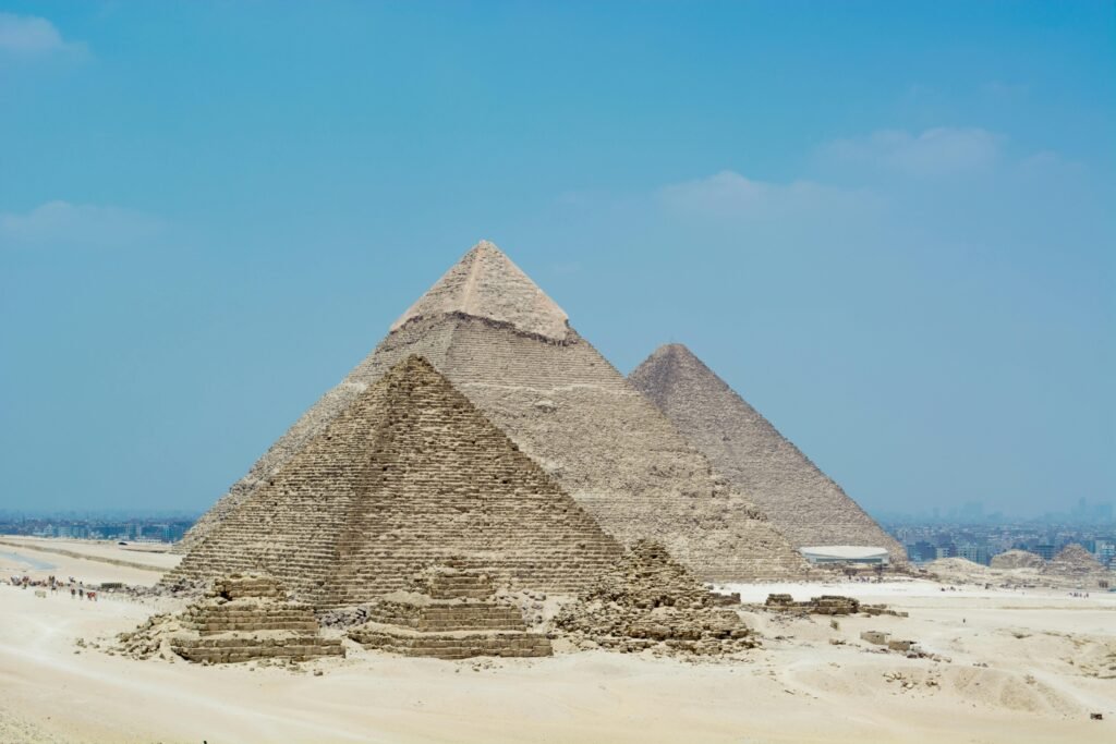 A stunning view of the Great Pyramids of Giza against a clear blue sky in Egypt.