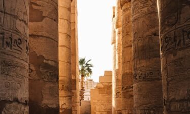 Discover the grandeur of ancient columns in Luxor, Egypt, showcasing rich historical architecture.