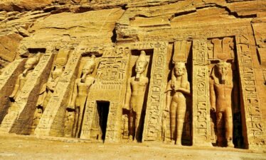 Detailed carvings on the Abu Simbel temple showcasing ancient Egyptian artistry.
